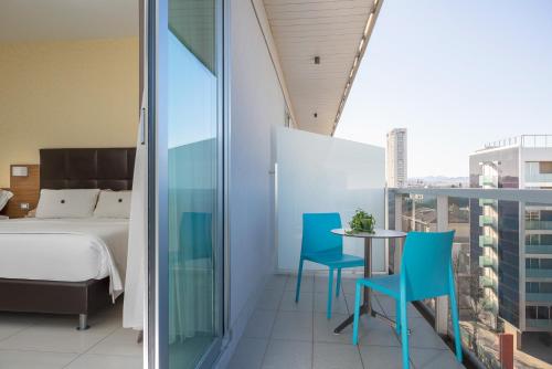 Llit o llits en una habitació de Aqua Hotel