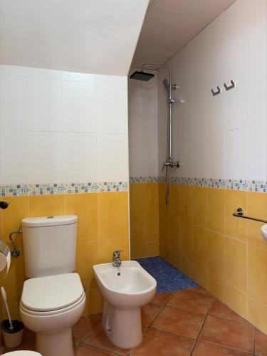 a bathroom with a toilet and a sink at House Lago Azul in Cuevas del Almanzora