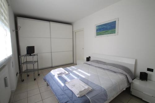 a bedroom with a bed and a tv in it at Casa Nicky in Abano Terme