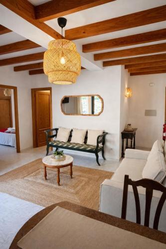 a living room with a couch and a table at Hostal Villa Verde-Adults Only in Deia