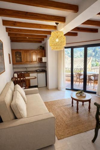 a living room with a couch and a table at Hostal Villa Verde-Adults Only in Deia