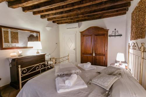 a bedroom with a large bed with towels on it at Florence Tower Apartment in Florence
