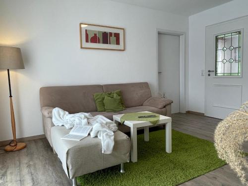 a living room with a couch and a table at Ferienwohnungen Geier in Niederalteich