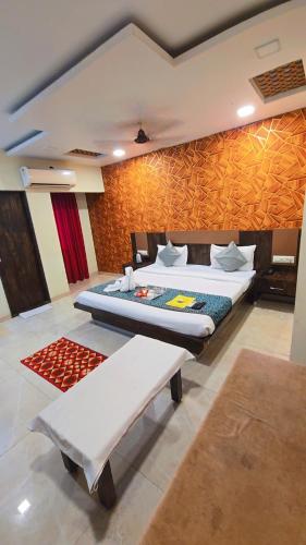 a bedroom with two beds in a room at Hotel Krishna in Nagpur