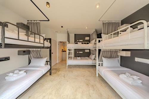 a room with four bunk beds in it at HOST'S EL Fisherman in Nathon Bay