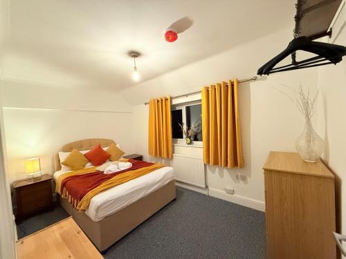 a bedroom with a bed and a window at Comfy, king bed families & Contractors welcome in St. Ives