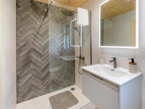 a white bathroom with a shower and a sink at 3 Bed in Cullompton oc-96118 in Willand