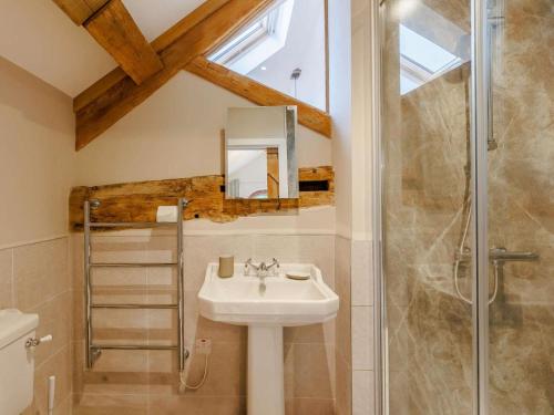 a bathroom with a sink and a shower at 3 Bed in Whitchurch oc-88915 in Whixall