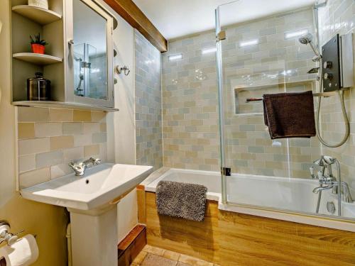 a bathroom with a sink and a shower at 4 Bed in Hereford oc-44213 in Hereford