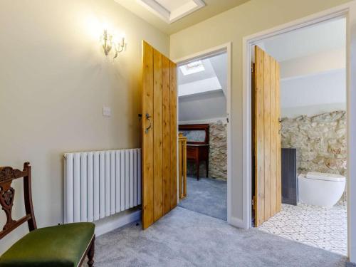 a hallway with a door leading to a bathroom at 2 Bed in Matlock oc-83435 in Bonsall