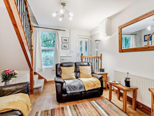 a living room with a chair and a mirror at 2 Bed in Ashbourne oc-85571 in Ashbourne