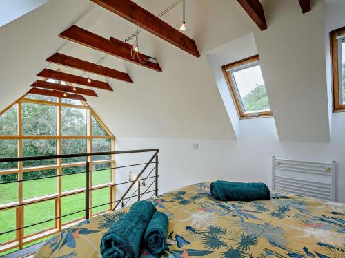 a bedroom with a bed and a large window at 6 Bed in Lechlade oc-93251 in Lechlade