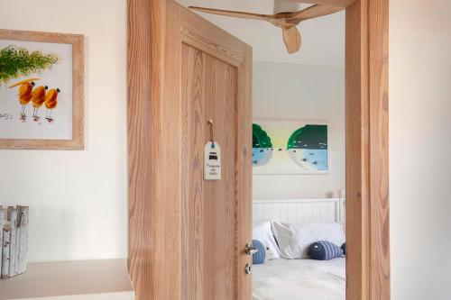 an open door in a room with a bed at Il Nido in Brenzone sul Garda