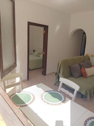 a living room with a couch and a mirror at Tranquil Villa La cabaa Galdar in Gáldar