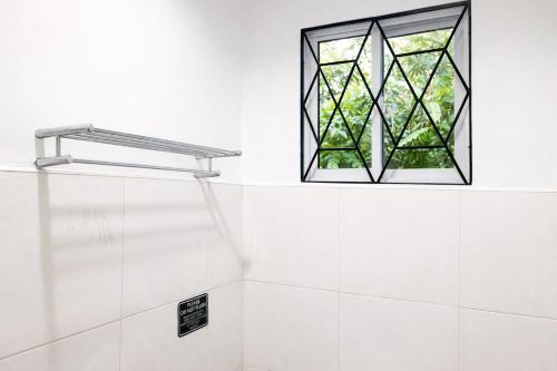 a window in a bathroom with a shower at Lelija Apartment in General Luna