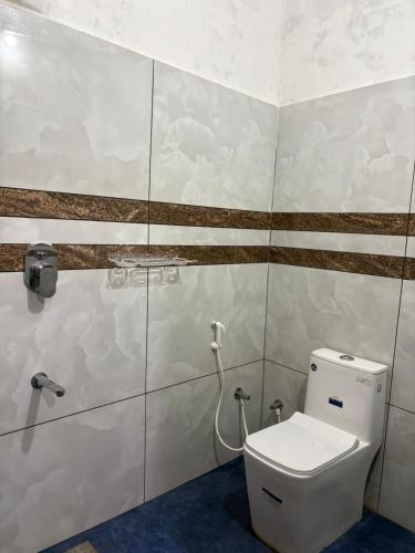 a bathroom with a toilet in a room at ARAMAM SERVICE VIlla in Mananthavady