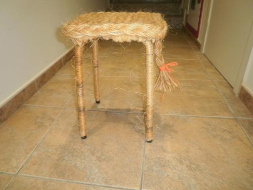 a stool sitting on the floor in a room at Hotel Victor in Rialp