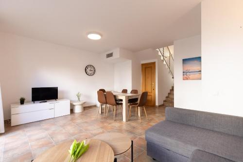 a living room with a table and a couch at Cumbre in Salou