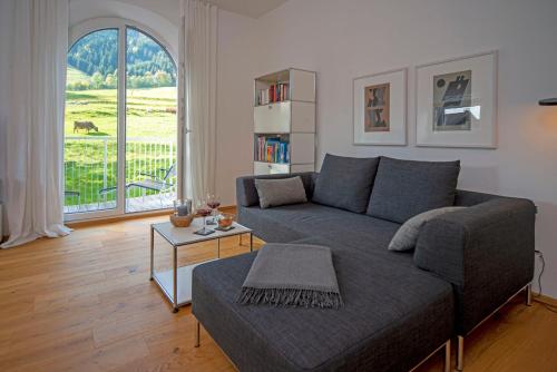 a living room with a couch and a table at Chalet am Breitenberg Apt1 in Pfronten