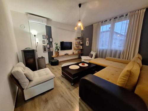a living room with a couch and a table at VP in Bajina Bašta