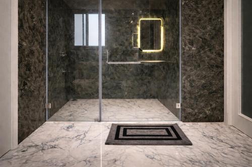 a shower with a glass door in a bathroom at Casa37 in Jaipur