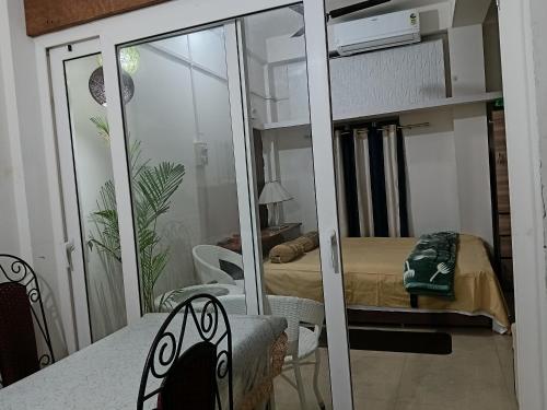 a bedroom with a bunk bed and a mirror at BiJOY VILLA in Guwahati