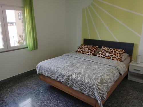 a bedroom with a bed and a window at Apartment Buic in Pula