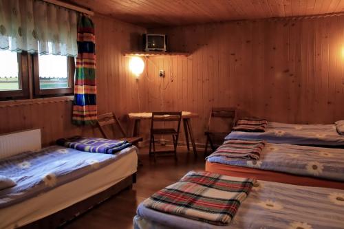 Letto o letti in una camera di Camping Pod Krokwią