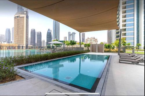 a swimming pool on the roof of a building at Prime Luxury Private Room in Downtown near Burj Khalifa in Dubai