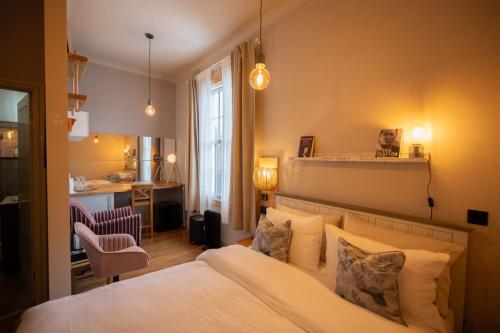 a bedroom with a large white bed in a room at The Pheasant in Broseley