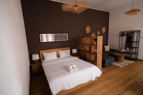 a bedroom with a bed with a teddy bear on it at Fly Residence 2 in Arad