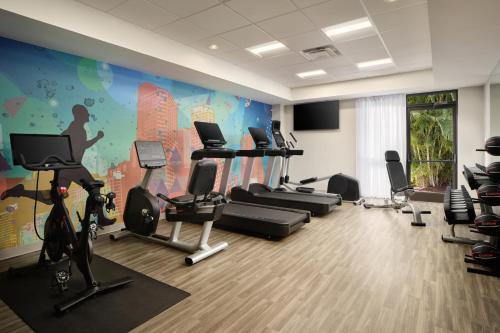 a gym with treadmills and exercise equipment in a room at Hyatt Place Tampa Airport/Westshore in Tampa