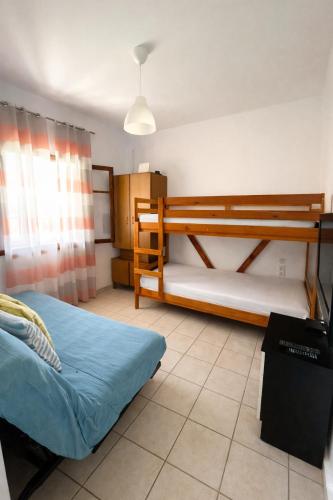 a bedroom with two bunk beds in a room at Sampa Villa in Asprovalta