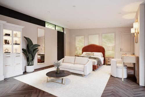 a living room with a bed and a white couch at Aysgarth Falls Hotel & Restaurant in Aysgarth