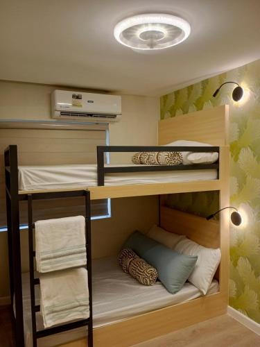 a bunk bed room with two bunk beds at Luxury Villa by Andres in San Juan