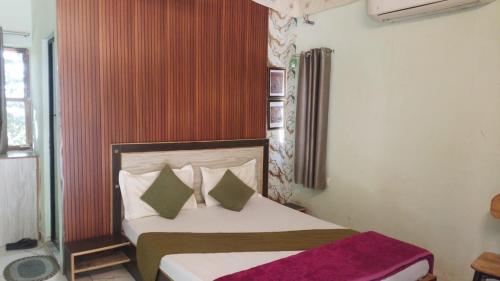 a bedroom with a bed in a room at Centre point jawai in Bīsalpur
