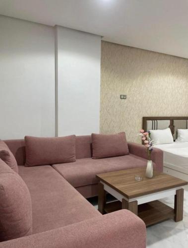 a living room with a couch and a bed at Central Sweet Stay in Tangier