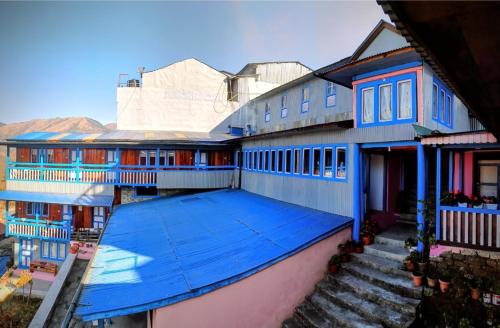 an overhead view of a building with a blue roof at Sagun's Place in Phāphlu