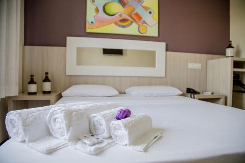 Katil atau katil-katil dalam bilik di Eunapolis Plaza Hotel