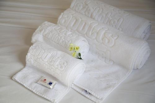 Postel nebo postele na pokoji v ubytování Eunapolis Plaza Hotel