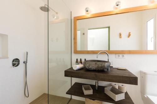 a bathroom with a sink and a mirror at Villas Etnia in Binissafuller