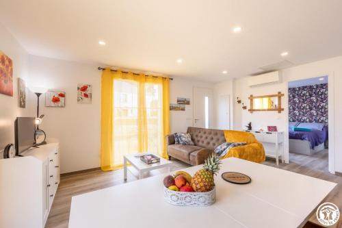 a living room with a couch and a table at Gite de l'artiste in Fay-les-Étangs