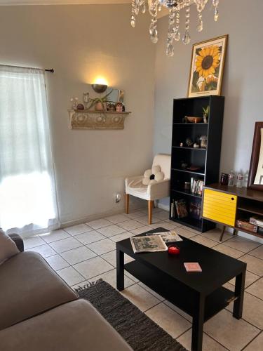a living room with a couch and a coffee table at Key to Austin Artistry in Austin