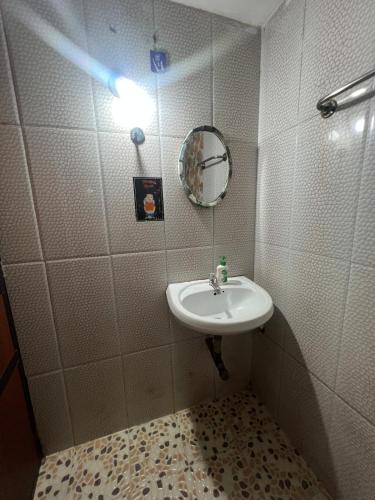 a bathroom with a sink and a mirror at The Wilderness Studio! in Anjuna