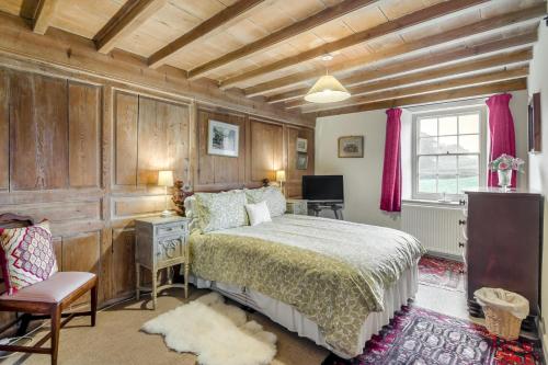 a bedroom with a bed and a desk and a window at 2 Bed in Hawes oc-c33371 in Hawes