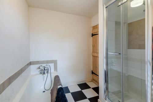 a bathroom with a shower and a glass shower stall at 2 Bed in Hawes oc-c33371 in Hawes