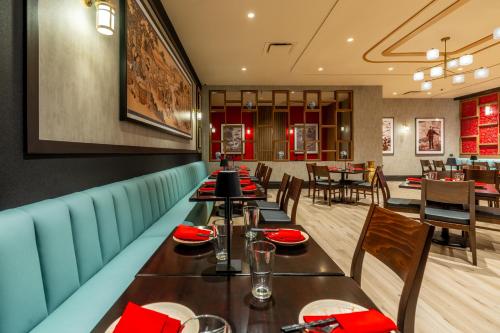 a dining room with a long table and chairs at Virgin River Casino and Lodge in Mesquite