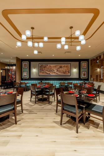 a dining room with wooden tables and chairs at Virgin River Casino and Lodge in Mesquite