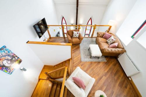 an overhead view of a living room with leather furniture at The Church Front in Montrose