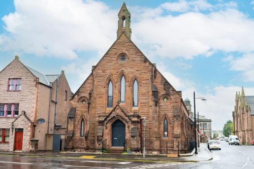 an old brick church on a city street at The Church Front in Montrose